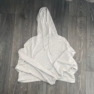This is a light grey cropped hoodie from garage! Size small! Never worn!